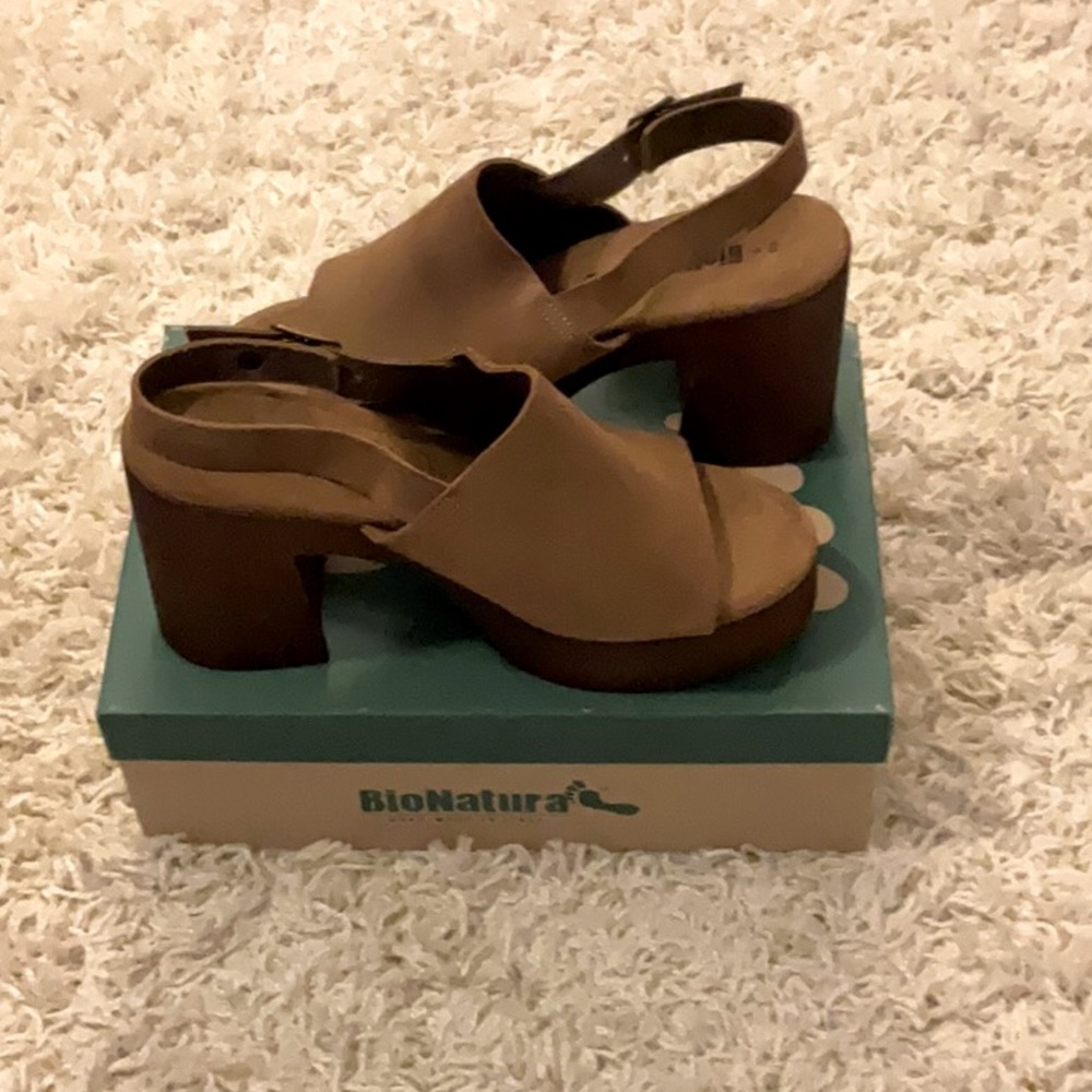 Wood look Platform Heel with padded insole, ankle strap and adjustable buckle.
